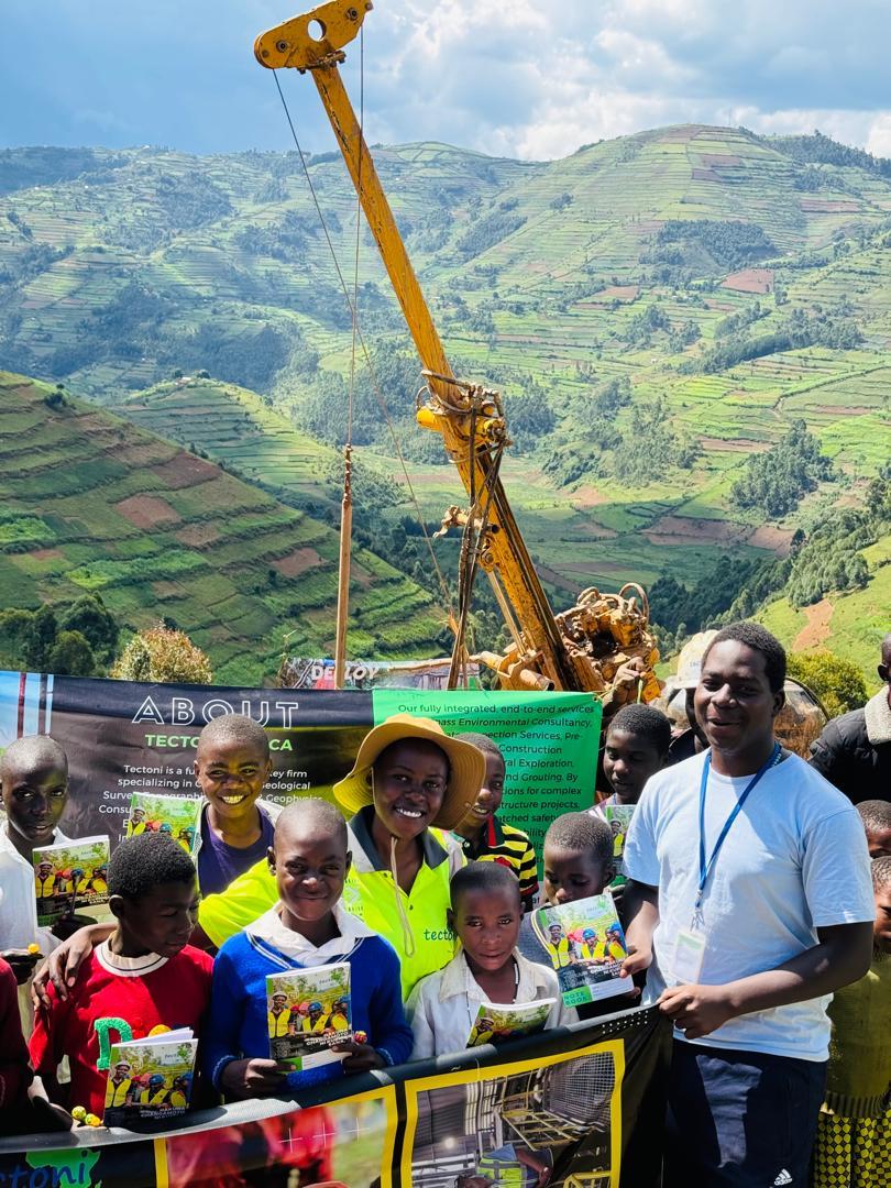 Community engagement with children and a Tectoni banner in the highlands